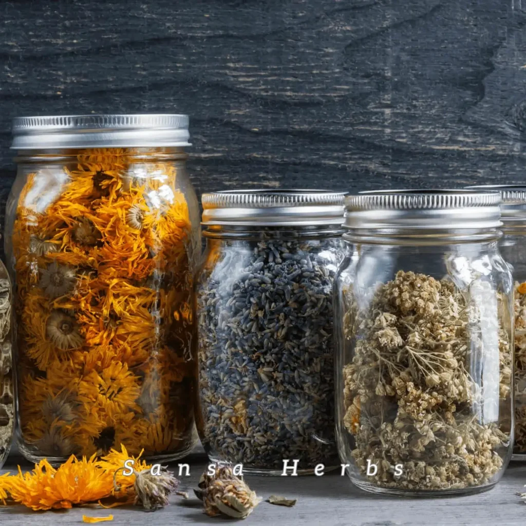 dried herbs in glass bottles
