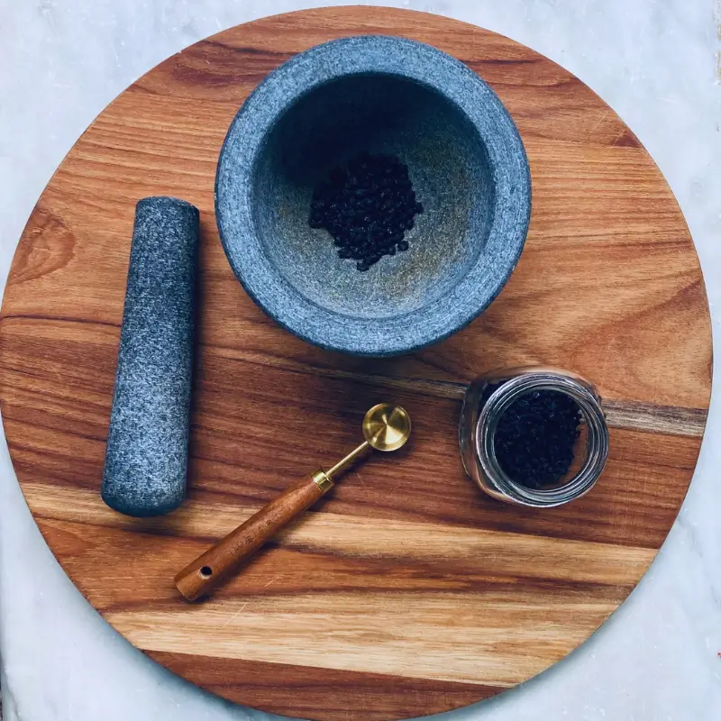 elderberry elderberries in mortar and pestle for cold and flu remedy